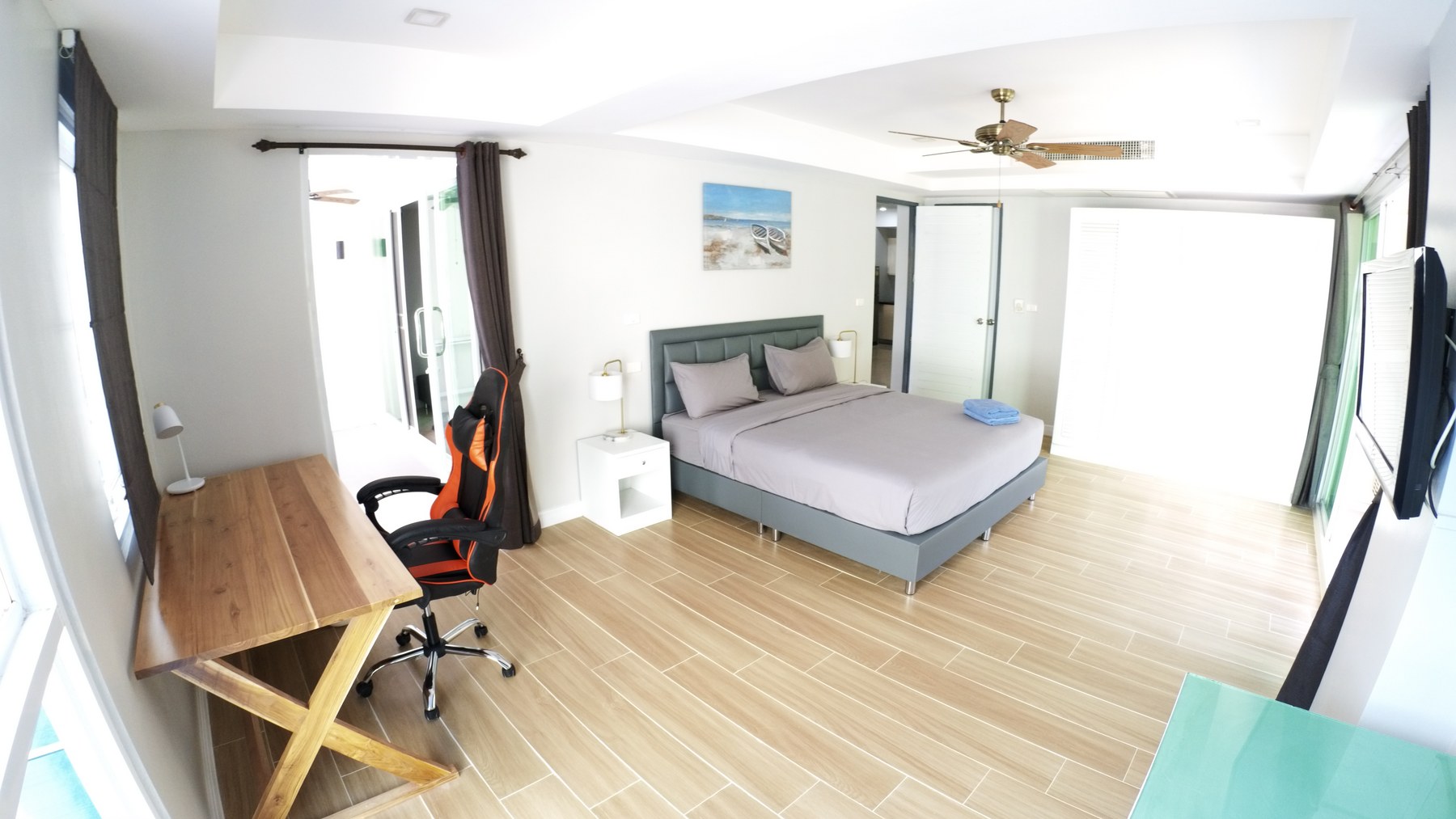 Bedroom and work desk in a Phuket condo